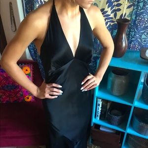 Long black evening dress with open back.